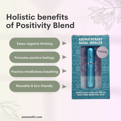 A pink background with an image of the blue positivity aromatherapy nasal inhaler and text that states holistic benefits of balance blend eases negative thinking, promotes positive feelings, practice mindfulness breathing, reusable and eco friendly