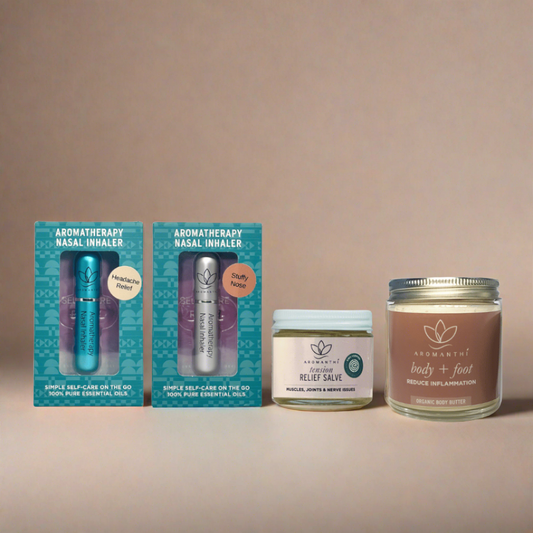 The physical wellnes self-care bundle by Aromanthi. Includes a white backdrop with 4 aromatherapy products which are Body + foot butter, EWG verified tension relief pain salve, headache relief aromatherapy nasal inhaler and stuffy nose aromatherapy nasal inhaler.