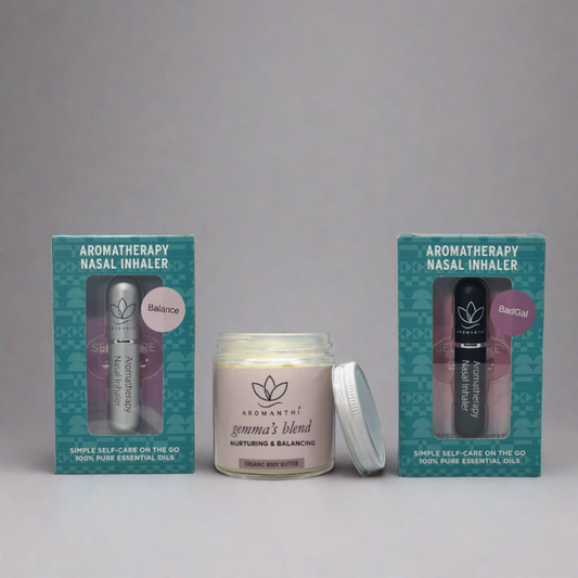 The self love bundle by Aromanthi for self-care. Includes a white backdrop with 3 aromatherapy products which are Gemma's blend body butter, badgal aromatherapy nasal inhaler and balance aromatherapy nasal inhaler