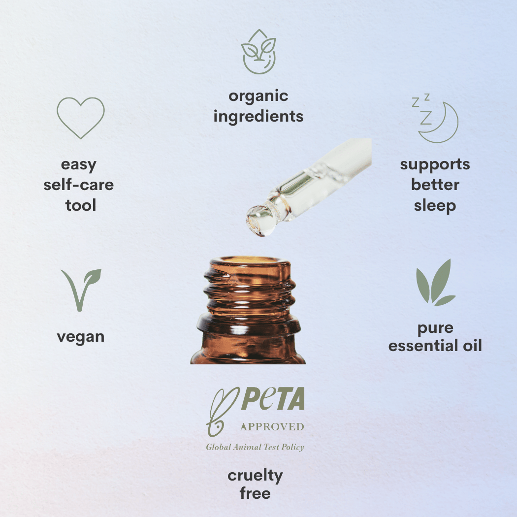 A close up view of an essential oil bottle with symbols and text surrounding stating organic ingredients, supports better sleep, pure essential oil, peta approved cruelty free, vegan product, easy self care tool