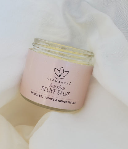 A pain salve by Aromanthi to relieve tension for muscles, joint and nerve issues. Made with essential oil and all natural organic ingredients like coconut oil, jojoba oil, rosewater, beeswax and rosemary oil, frankinsence oil.