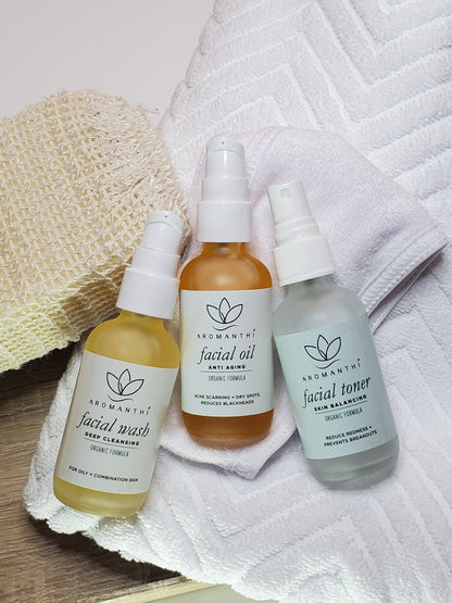 A photo of Aromanthi's facial wash, facial oil and facial toner laying on a skincare towel.